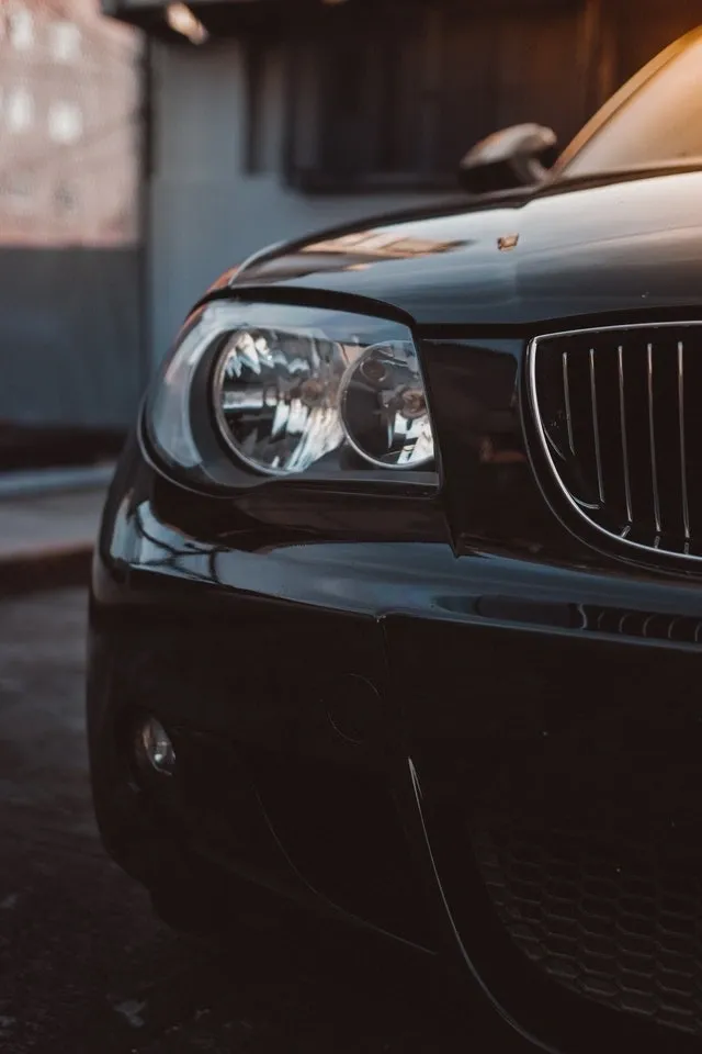 A close up of the headlight on a car.