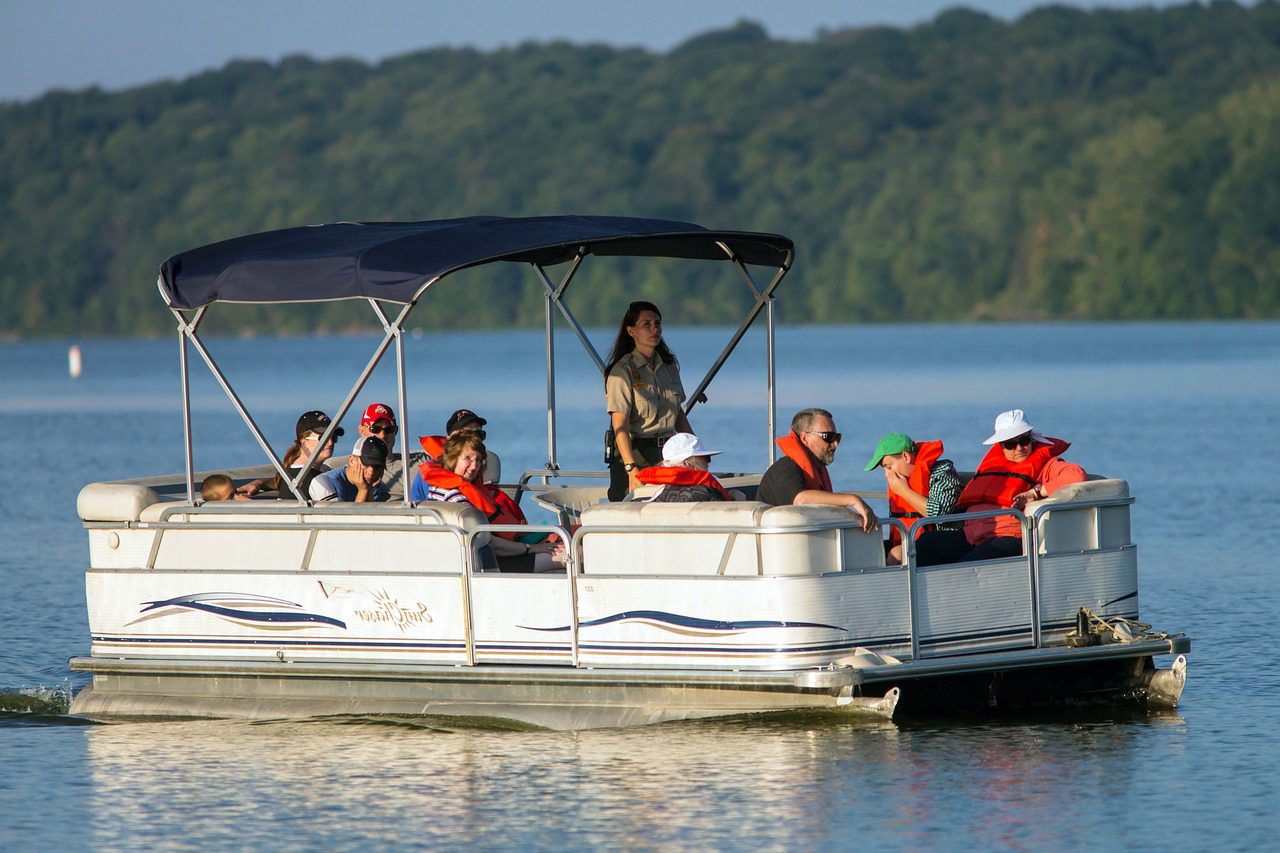 A group of people in a boat on the water.