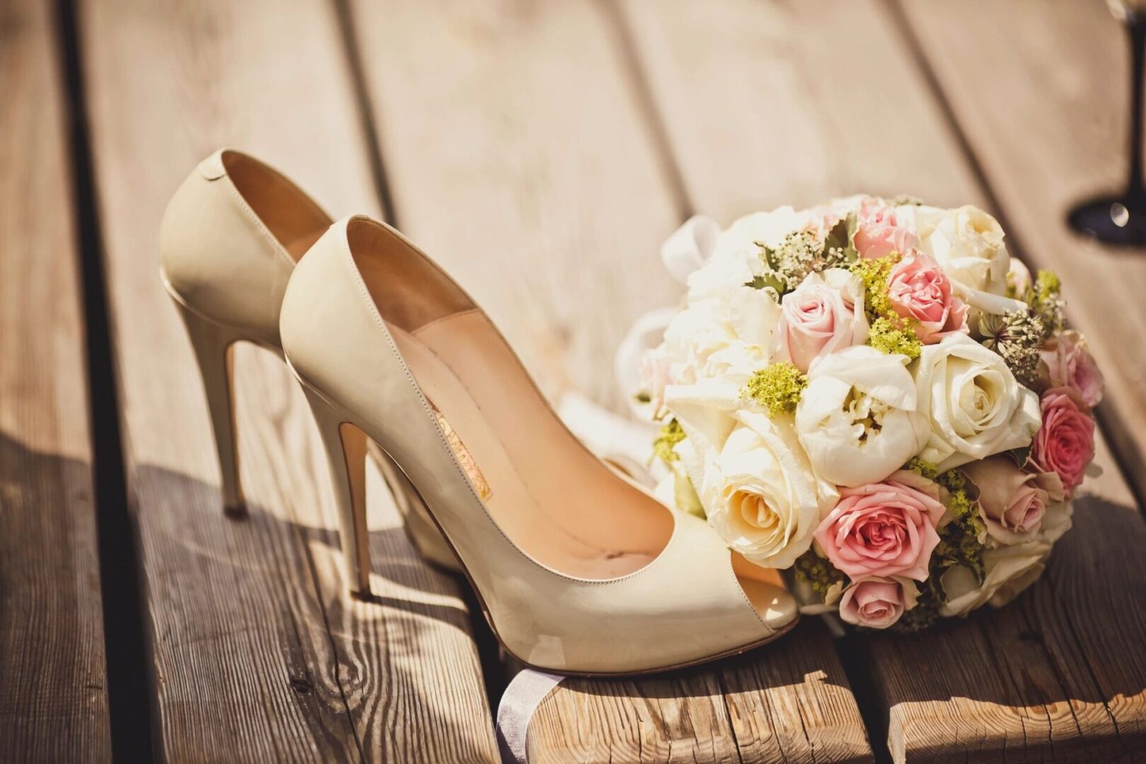 A bouquet of flowers sitting on top of a wooden table.